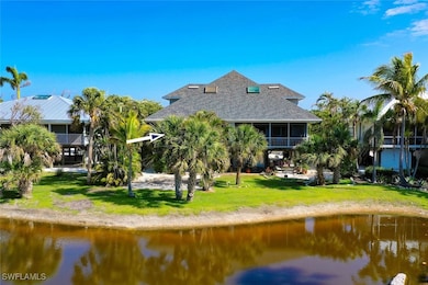 Rear view of property with roof with shingles, a l