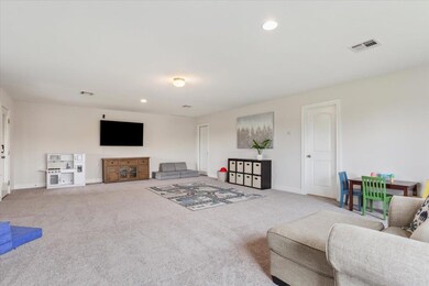 Living room with recessed lighting and carpet flooring