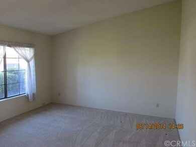Formal living room with vaulted ceilings