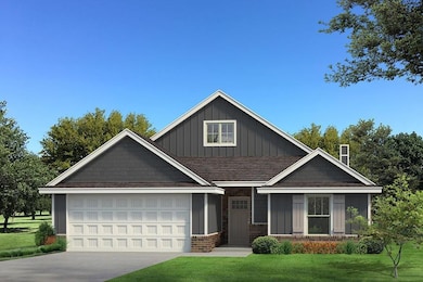 Craftsman-style house featuring board and batten siding, a front lawn, concrete driveway, a shingled roof, and brick siding
