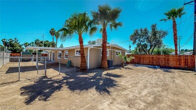 Large backyard with additional fencing. Large palm