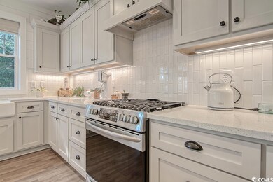 Tasteful oven hood in this chef's kitchen. Plenty 