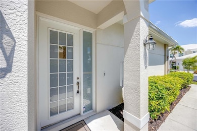 View of exterior entry featuring stucco siding