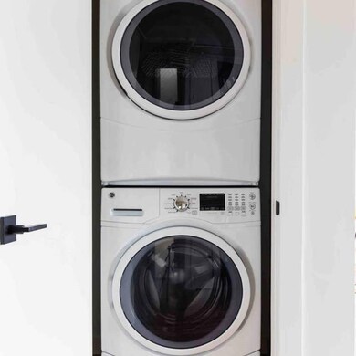 Clothes washing area with stacked washer / drying 