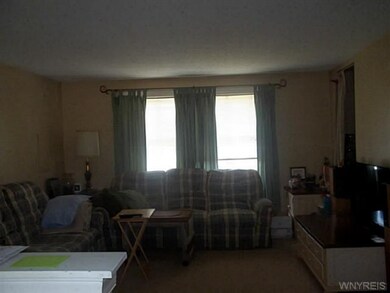 Living Room. Decent size, open to dining area and 