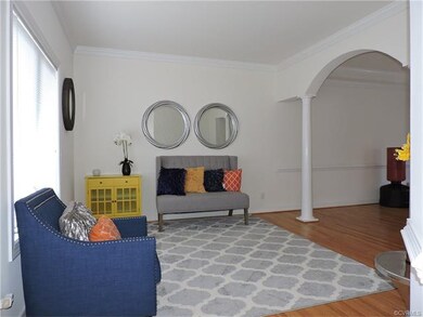 Living Room with Hardwood Floors and Columns