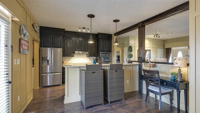 The living room is open to the beautiful and functional kitchen. There's a wonderful breakfast bar to help you start the day.