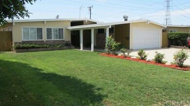 This house has great curb appeal with its newly painted exterior and well maintained yard.