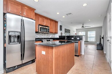 Spacious well-lit kitchen with island 