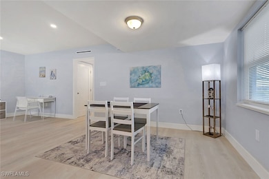 Dining room featuring light wood finished floors and recessed lighting