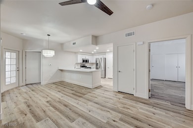 Kitchen featuring stainless steel appliances, a pe