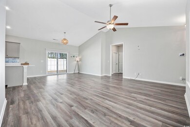 Unfurnished living room with dark hardwood / wood-