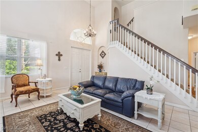 Living room with light tile patterned floors, a hi