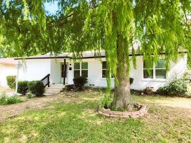 View of front of property with a front lawn