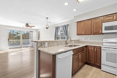 Kitchen featuring light wood-type flooring, white 