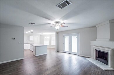 Unfurnished living room featuring a ceiling fan, 