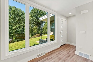 Bright and inviting entry and gorgeous windows to 