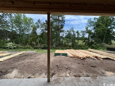 View of patio / terrace featuring view of wooded area