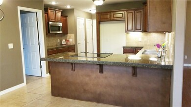 Kitchen has lots of counter space and cabinetry for all your culinary aspirations !