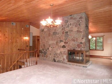 An expansive floor to ceiling, 3-sided fireplace w