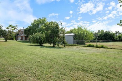 View of yard with a rural view