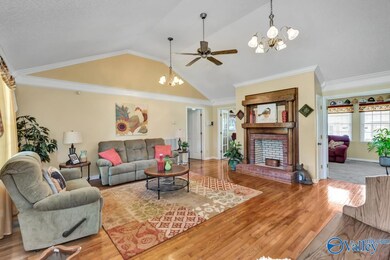 Featuring wood flooring, vaulted ceiling, ceiling 