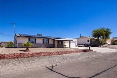 Single story home featuring stucco siding, a garag