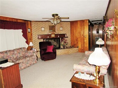 Large den is just off kitchen!