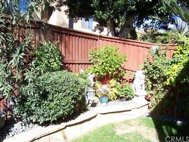 Nice little patio yard area with plants and some l