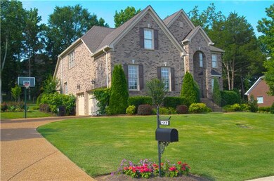 Home features large side entrance garage and basketball court!