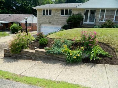 Exterior Front. Additional landscaping.