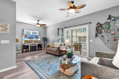 Living area featuring wood finished floors, a heal