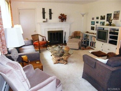 Spacious living room with wood-burning fireplace