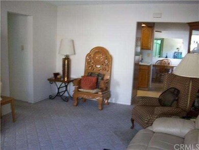 Looking from living room into dining area and fami