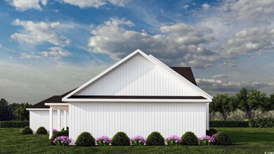 View of side of home with a lawn