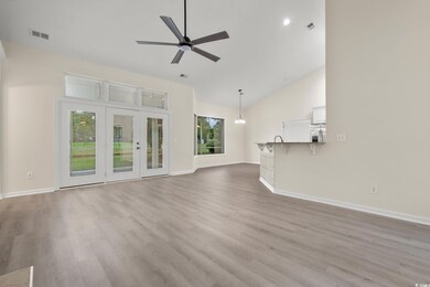 Unfurnished living room with light LVP wood-type f