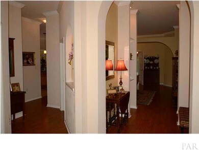 Entry way leading to kitchen and living room.
