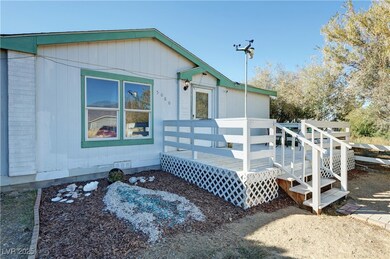 View of property exterior featuring a wooden deck