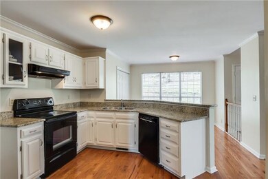 Breakfast nook on the other side of the kitchen is perfect for your cup of morning coffee and looking out into the private backyard.
