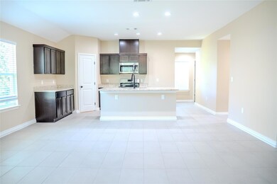 Kitchen with appliances with stainless steel fini