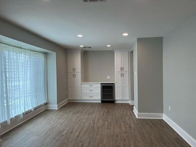 Dining room with built-ins and beverage cooler