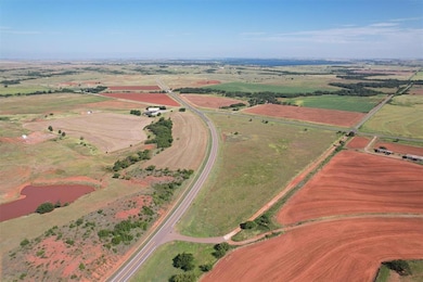 Aerial view of property's location featuring rural landscape and a large body of water
