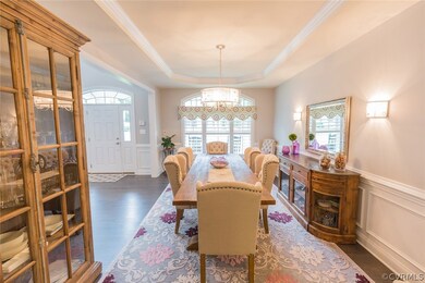 Large arched windows with plantation shutters in d