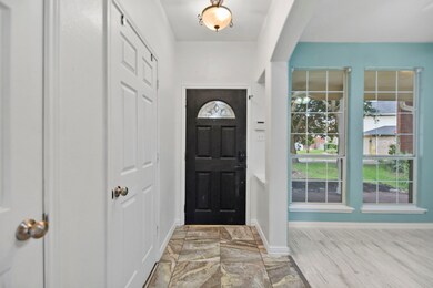 As you enter the home, the formal dining room will