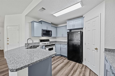 New kitchen cabinets, granite and sink.  Opens up to the living room for easy entertaining