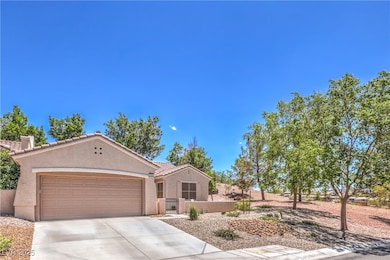View of front of house featuring stucco siding, a