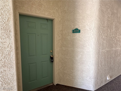 View of exterior entry featuring stucco siding
