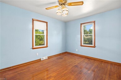 Hardwood floored bedroom featuring plenty of natur