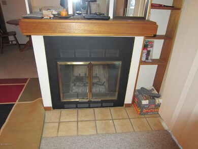 Fireplace w/built-in shelving