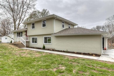2 car garage with new driveway and sidewalk.
